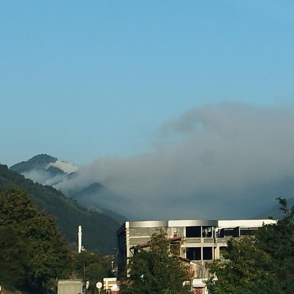 May be an image of 1 person, cloud, mountain and fog